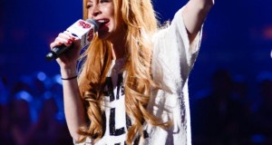 Lindsay Lohan introduces Miley Cyrus at Jingle Ball